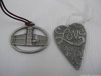 Both ornaments front view showing designs and hangers