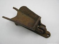 side profile showing wheelbarrow form and pivoting wheel