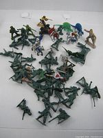 overview of mixed toy soldier and knight figures spread out