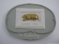 Front view of oval porcelain plaque showing overall design and inscriptions