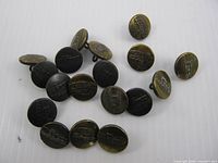 Group of 18 round metal buttons showing fronts