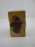 Front view showing porcupine graphic on three cube sections