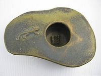 top view showing lizard relief, opening with kenzan, glaze coloration
