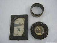Front view of rectangular frame, round frame, and napkin ring