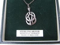 Pendant close-up in box showing sterling silver Celtic design and label