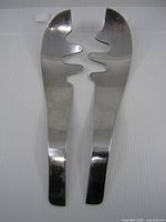 Front view of both Umbra salad servers