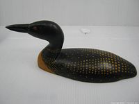 Left side view of carved loon showing paint pattern and form