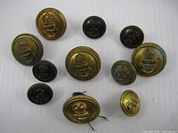 Group of eleven naval uniform buttons, assorted finishes and sizes