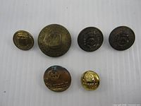 All six Canadian military buttons front view