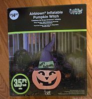 Front of box showing Airblown Inflatable Pumpkin Witch, height 3.5 ft, Gemmy branding, price sticker