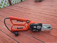 Black & Decker Alligator lopper side view showing bar, chain, housing and cord