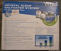 Front of sealed box showing Intex Krystal Clear Saltwater System branding and feature list