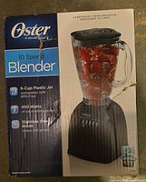 Front of Oster 10-speed blender box showing model, power and jar capacity
