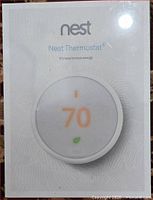Front of sealed Nest Thermostat E box showing product image and branding