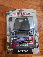 Front view Brother PT-1880 labeler sealed blister pack