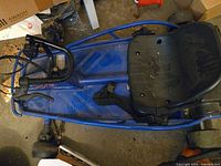 Top view of entire kart showing frame, seat, wheels and steering assembly