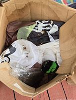 Deflated inflatables, blower unit and hardware inside worn box