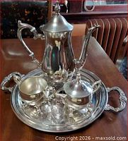 Full view of entire four-piece silver-plated set on tray