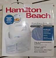 Front of Hamilton Beach hand mixer retail box showing model features