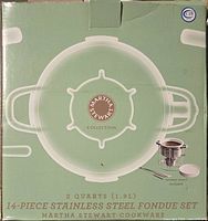 Retail box of Martha Stewart Collection 14-piece stainless steel fondue set showing 2 qt capacity and ceramic insert included