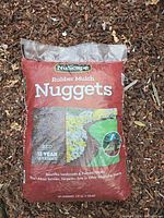 Front view of NuScape Rubber Mulch Nuggets bag showing branding, size, color
