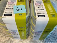 Front view of two stacks of boxed Komax Biokips 5-piece foodsaver sets