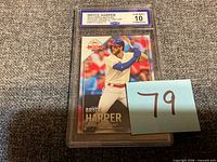Front view of slabbed Bryce Harper 2019 Topps card showing grade label and card image