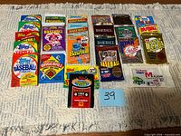 Overview of all 24 unopened baseball card packs laid out on table