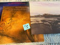 Three album jackets partially overlapping showing titles