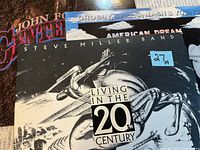 Three vinyl album covers partially overlapped showing all titles