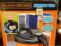 Front of boxed Black+Decker Junior Vac showing branding and features