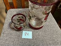 Both candle holders side by side on fabric surface