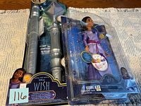 Overall view showing both packaged Disney Wish toys