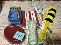 overview of all items including sponge pack, towels, brushes, duster and bowl
