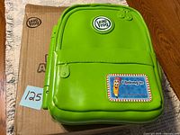 Closed green LeapFrog backpack on box