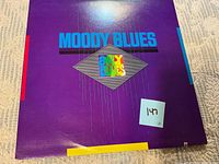 Front cover of purple sleeve showing Moody Blues Early Blues artwork