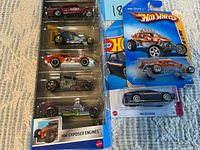 Overall lot showing 5-pack and two single Hot Wheels blister packs