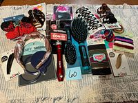 Overview of all packaged hair accessories arranged on surface