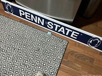 full Penn State side of sign on floor
