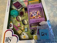 Front view of boxed Disney ily 4ever Rapunzel accessory set showing all components in blister packaging