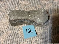 Top view of grey crystal cluster specimen