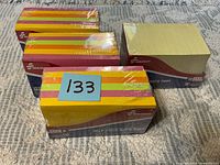 Four sealed packs of Skilcraft self-stick note pads