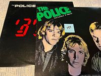 Front jackets of both albums