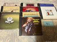 Group shot of all eight CDs showing front artwork