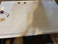 Full view of whiteboard with grid, magnets, markers