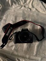 Front view showing entire camera, lens and strap