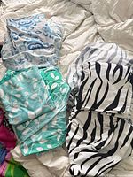 Overview of the three patterned fitted sheet sets with pillowcases