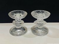 Front view of both textured glass candle holders