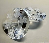 Both crystal candle holders top view showing snowflake design and labels