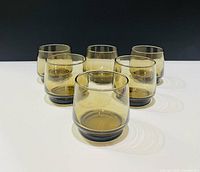 Six smoked glass lowball tumblers front view